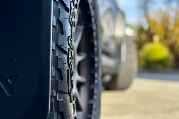 Close-up of high-quality tyres on a Toyota Hilux for 4WD rental in Christchurch, NZ